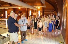 Lion President Brian with Lion Kev presenting 100 to swimming club